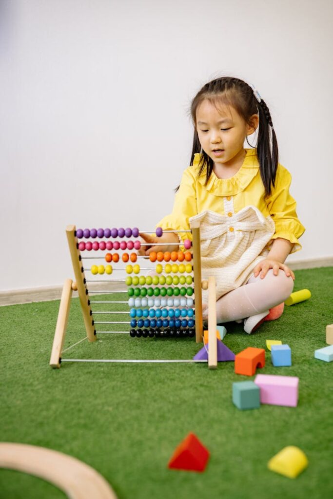 A young girl engaged with a colorful abacus in a cozy playroom setting, emphasizing learning and play.