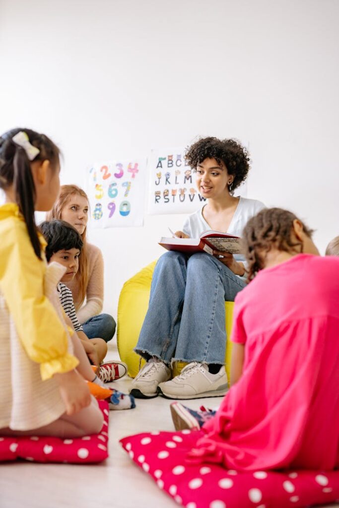 Teacher reading to attentive preschool children in an engaging classroom setting.